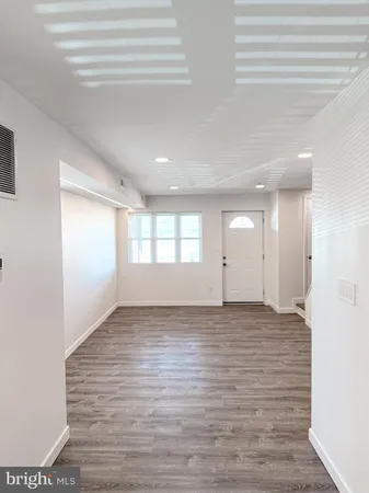 a view of an empty room and window