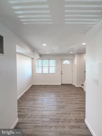 a view of an empty room and window