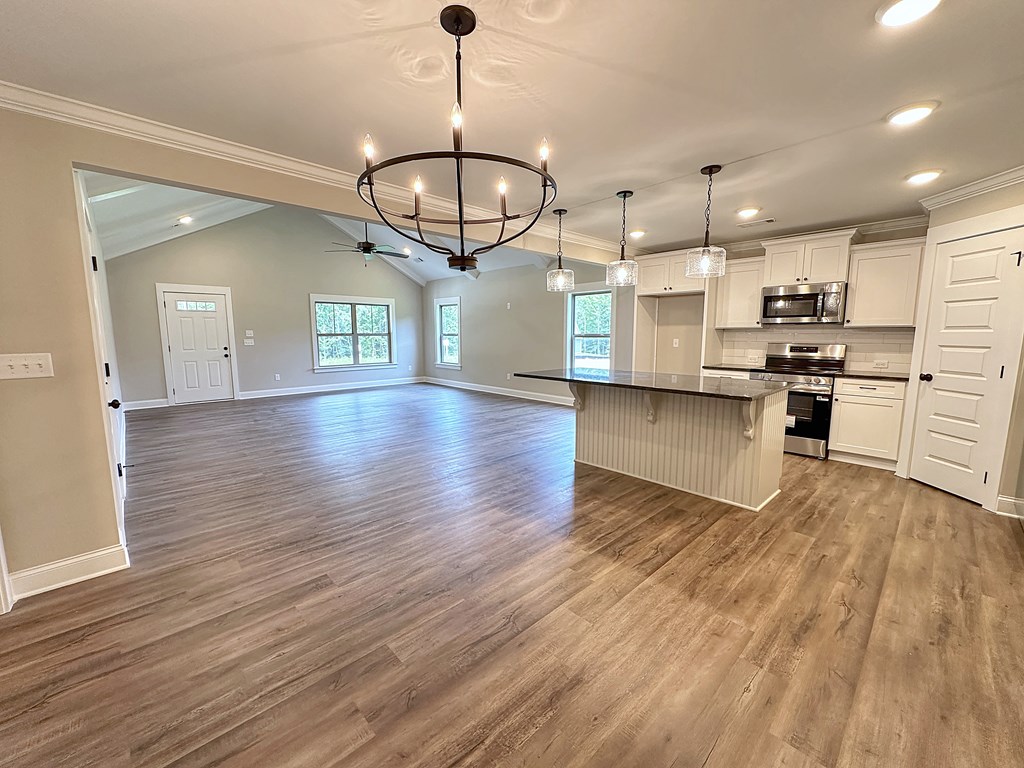 270 Young Lane Hamilton, GA 31811 - Photo 11 of 28 a view of a kitchen with a sink stainless steel appliances and wooden floor