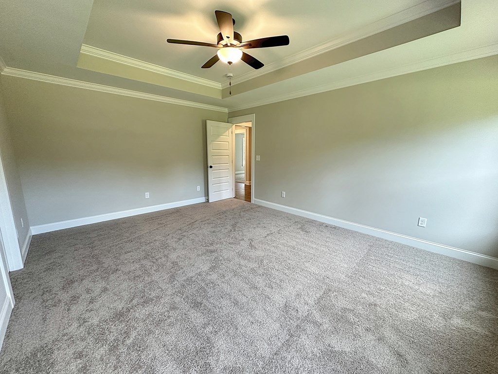 270 Young Lane Hamilton, GA 31811 - Photo 18 of 28 an empty room with a ceiling fan and a window