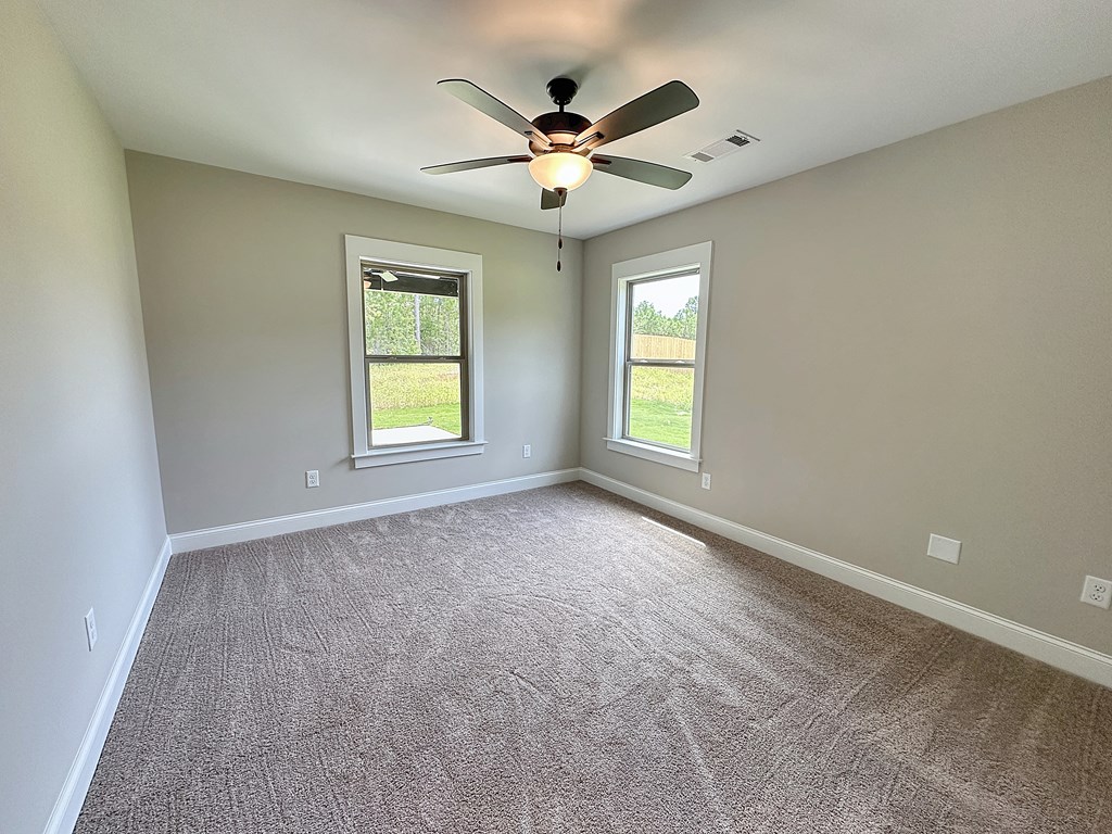 270 Young Lane Hamilton, GA 31811 - Photo 20 of 28 an empty room with ceiling fan and window