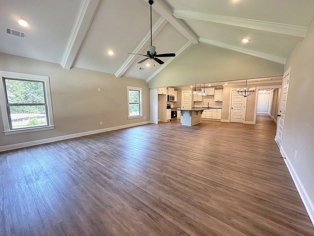 270 Young Lane Hamilton, GA 31811 - Photo 3 of 28 a view of a room with wooden floor ceiling fan and windows