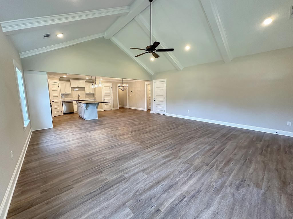 270 Young Lane Hamilton, GA 31811 - Photo 4 of 28 a view of a room with wooden floor a ceiling fan and windows