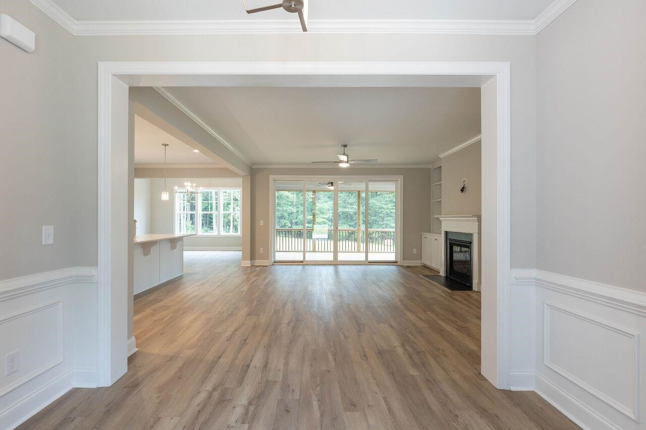 9616 Chris Drive Raleigh, NC 27603 - Photo 12 of 42 wooden floor in an empty room with a window