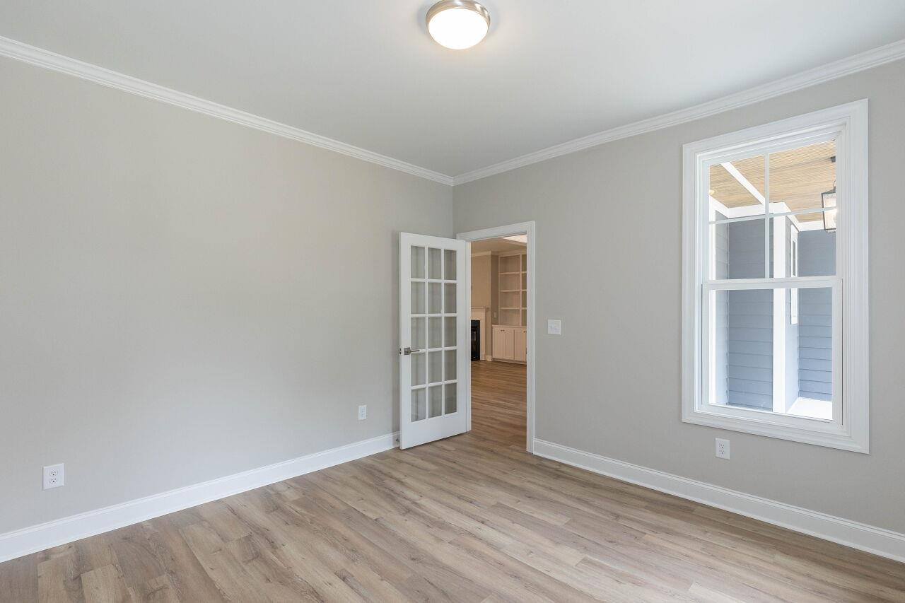 9616 Chris Drive Raleigh, NC 27603 - Photo 15 of 42 an empty room with windows and closet