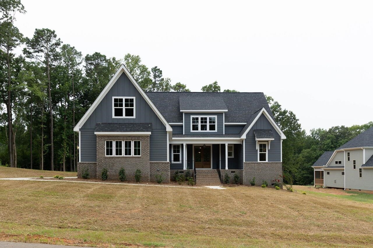 9616 Chris Drive Raleigh, NC 27603 - Photo 2 of 42 a front view of a house with a yard