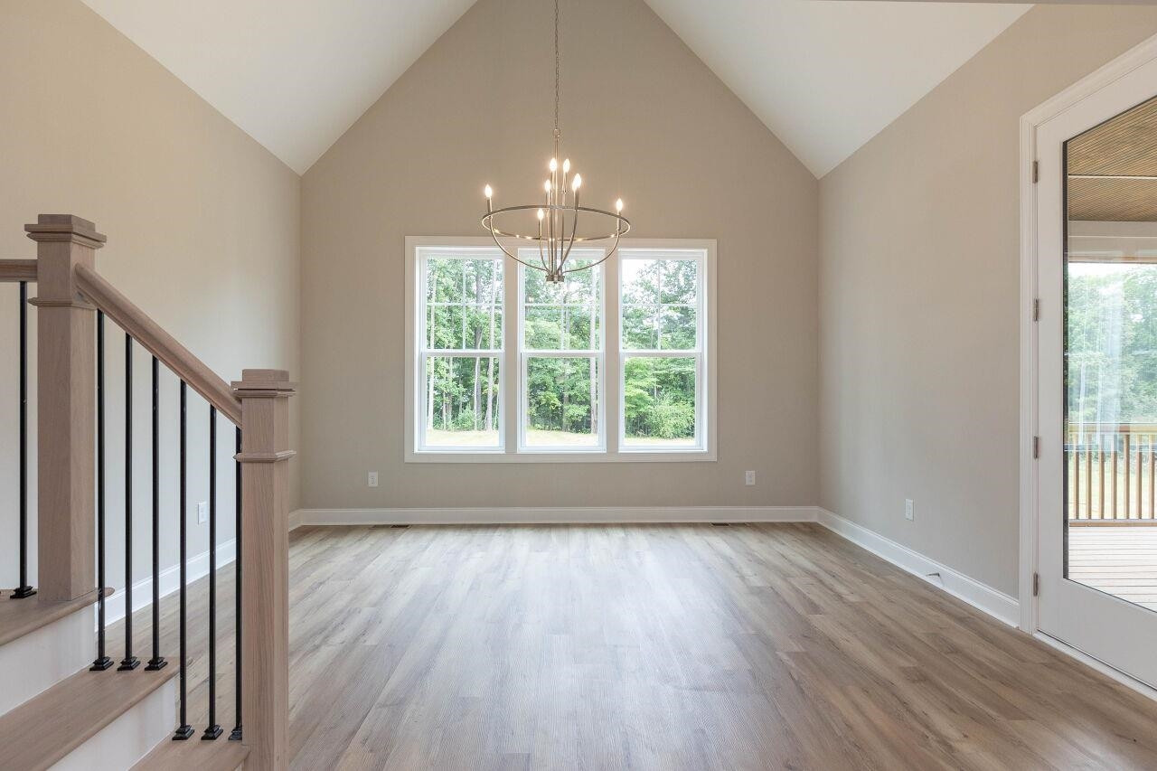 9616 Chris Drive Raleigh, NC 27603 - Photo 24 of 42 wooden floor in an empty room with a window