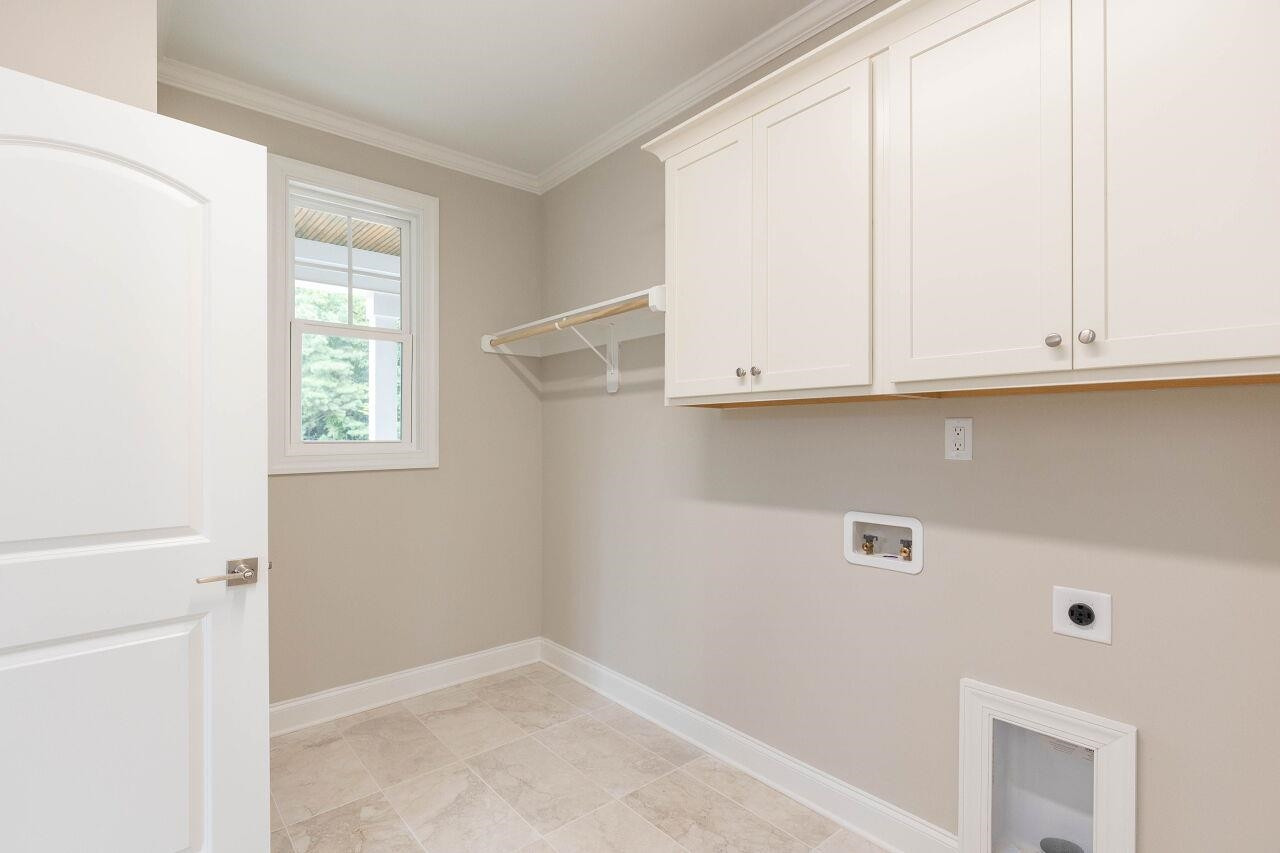 9616 Chris Drive Raleigh, NC 27603 - Photo 31 of 42 a view of cabinets and window