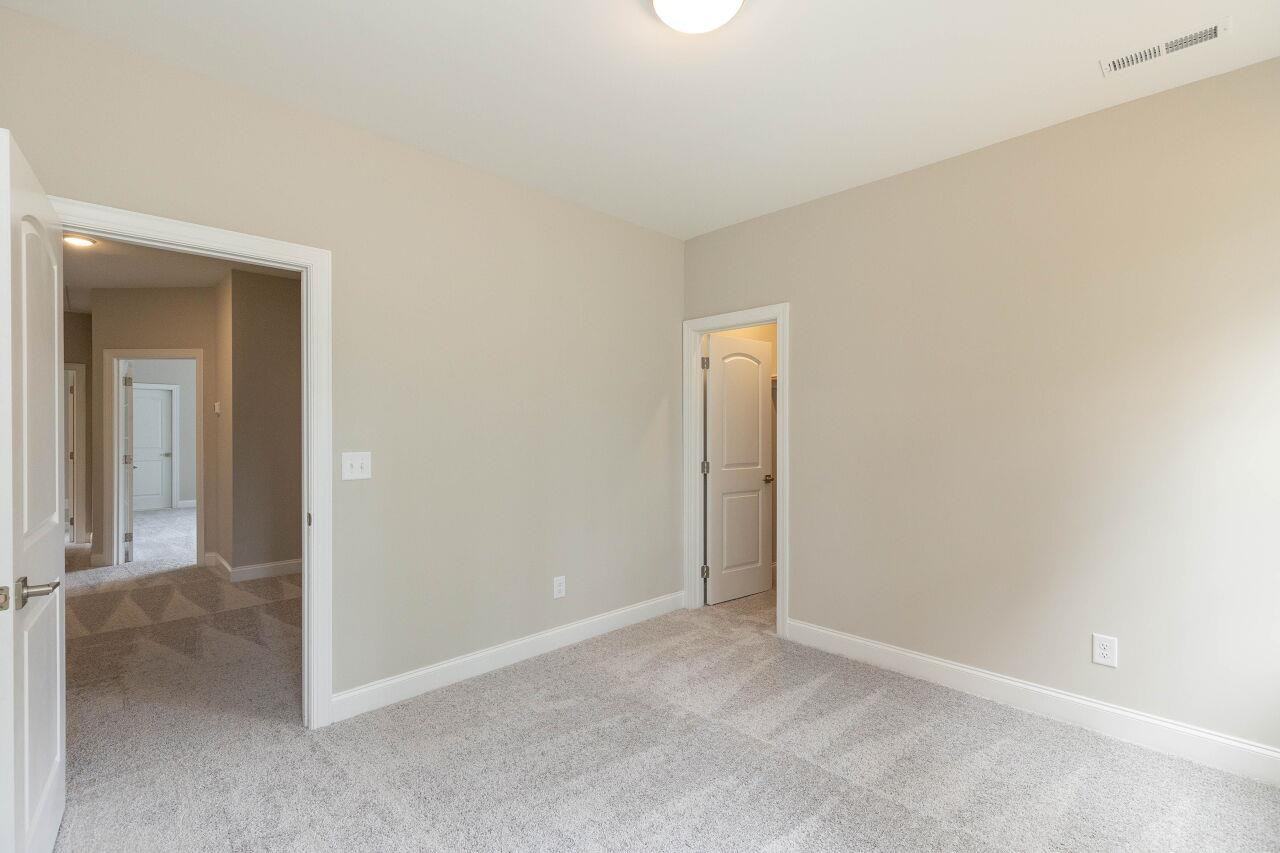 9616 Chris Drive Raleigh, NC 27603 - Photo 37 of 42 a view of an empty room