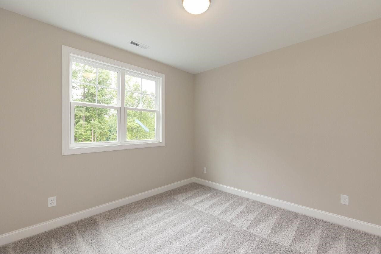 9616 Chris Drive Raleigh, NC 27603 - Photo 42 of 42 an empty room with a window