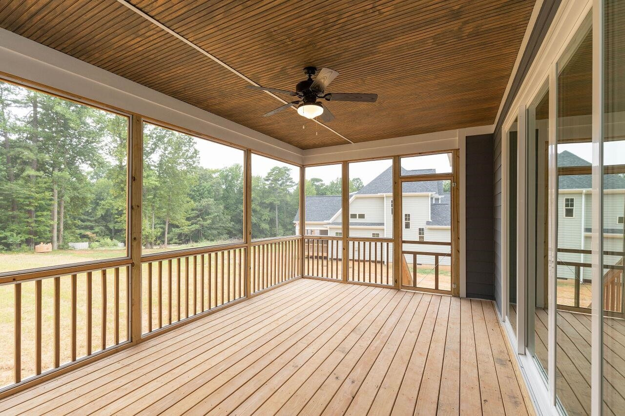 9616 Chris Drive Raleigh, NC 27603 - Photo 7 of 42 a view of a balcony with wooden floor