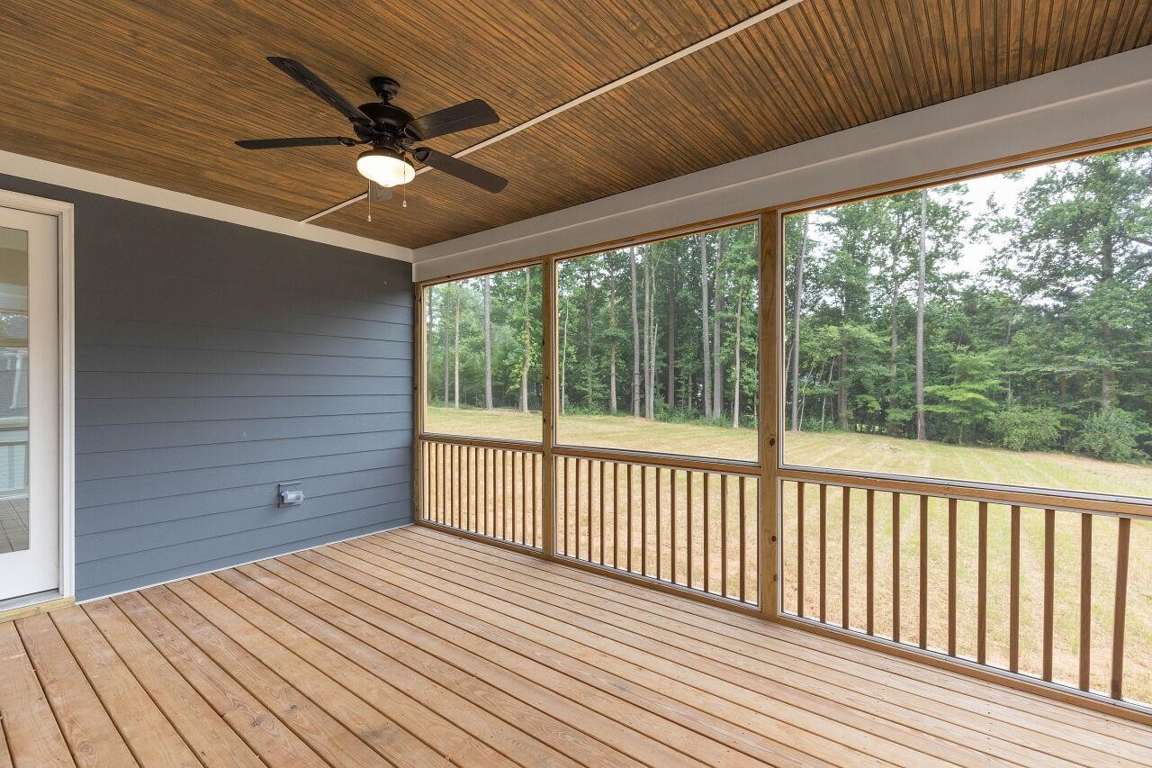 9616 Chris Drive Raleigh, NC 27603 - Photo 8 of 42 a view of a balcony with wooden floor