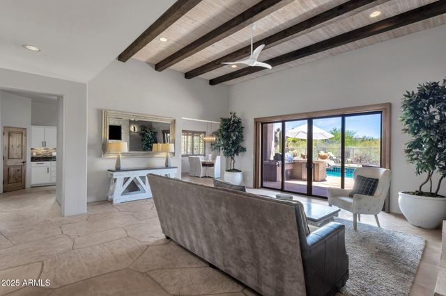 a kitchen with a sink a counter space appliances and cabinets