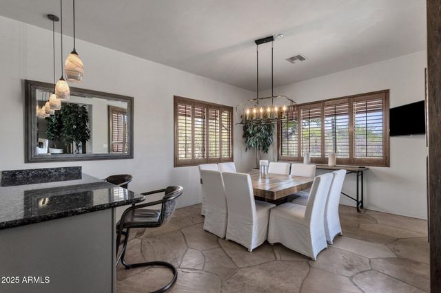 a kitchen with granite countertop a sink and a stove