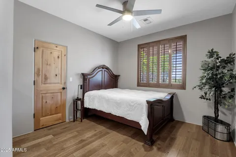 a spacious bedroom with a bed and a couch