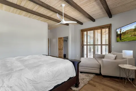 a bathroom with a shower and toilet