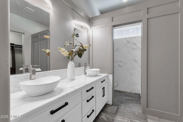 a building outdoor space with patio furniture and potted plants