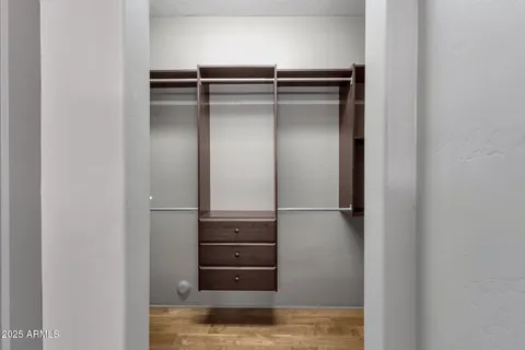 a view of a patio with a table and chairs under an umbrella