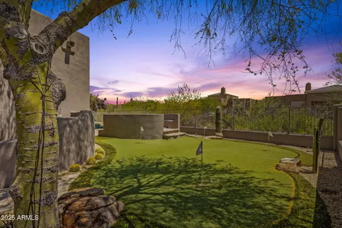 a view of swimming pool with an outdoor seating