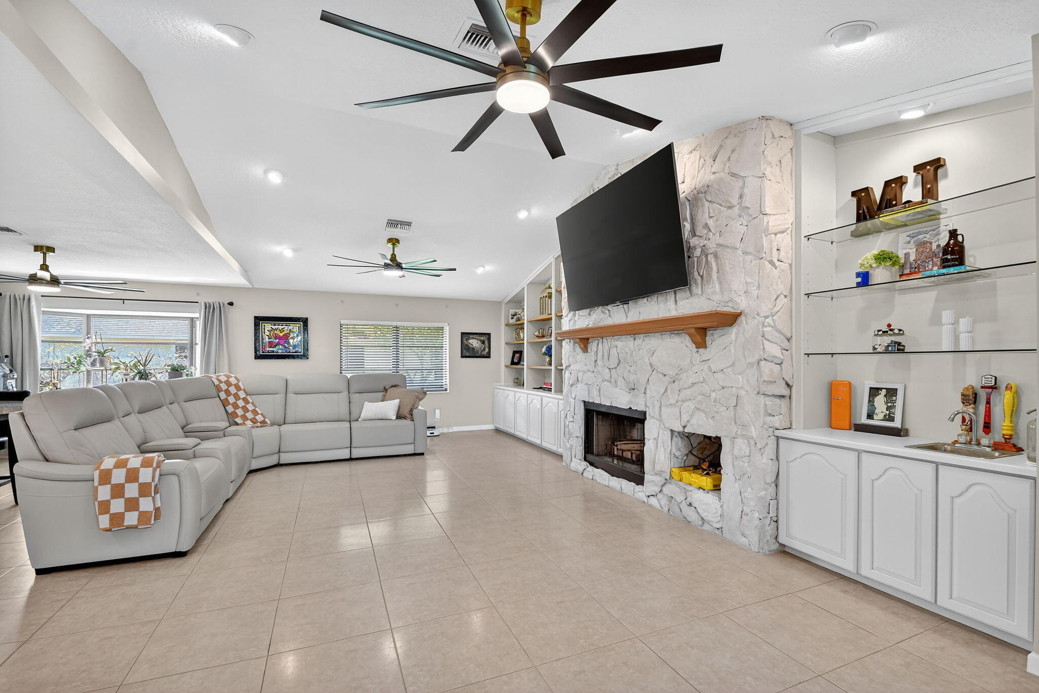 4270 Fox Trace Road Boynton Beach, FL 33436 - Photo 13 of 46 a living room with furniture and a fireplace