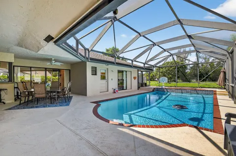 a view of swimming pool with outdoor seating