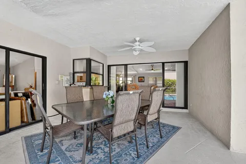 a view of a dining room with furniture and a livingroom