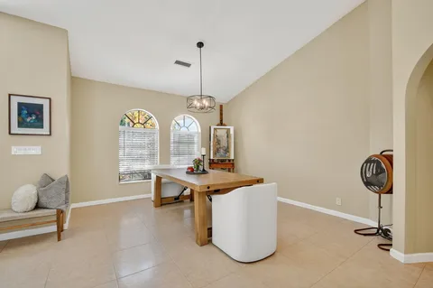 a room with gym equipment and windows