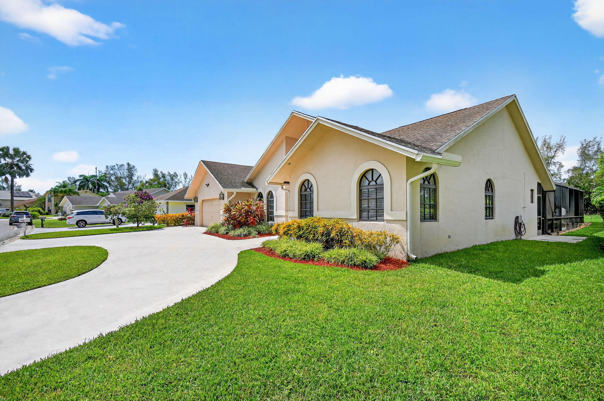 4270 Fox Trace Road Boynton Beach, FL 33436 - Photo 39 of 46 a front view of a house with a yard and garage