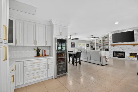 a view of kitchen with furniture and fireplace