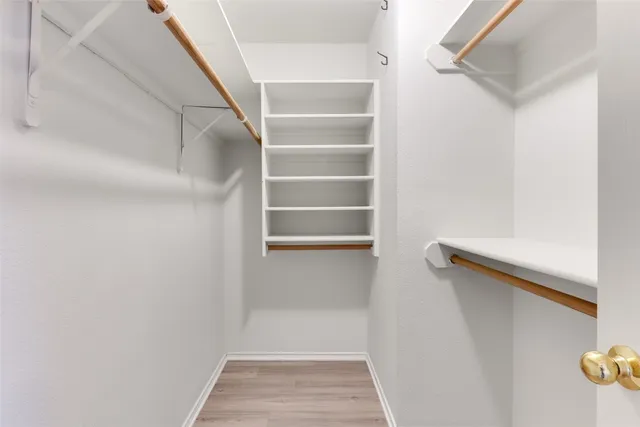 a bathroom with double sink and a mirror