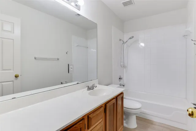 a view of a house with a yard and porch