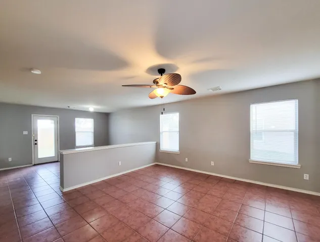 a view of an empty room and window
