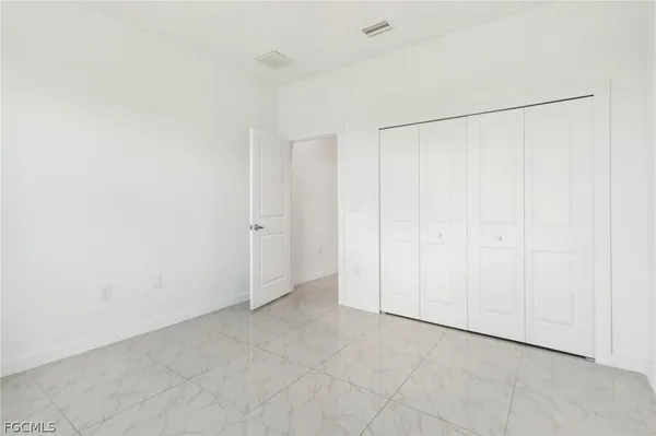 an empty room with a shower