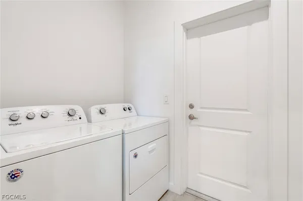 a view of storage and utility room with washer and dryer