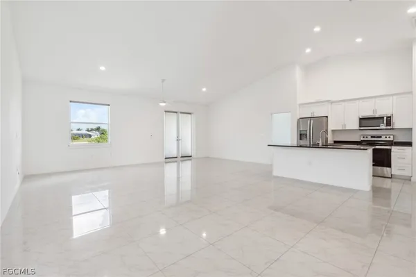 a view of kitchen with cabinets and wooden floor