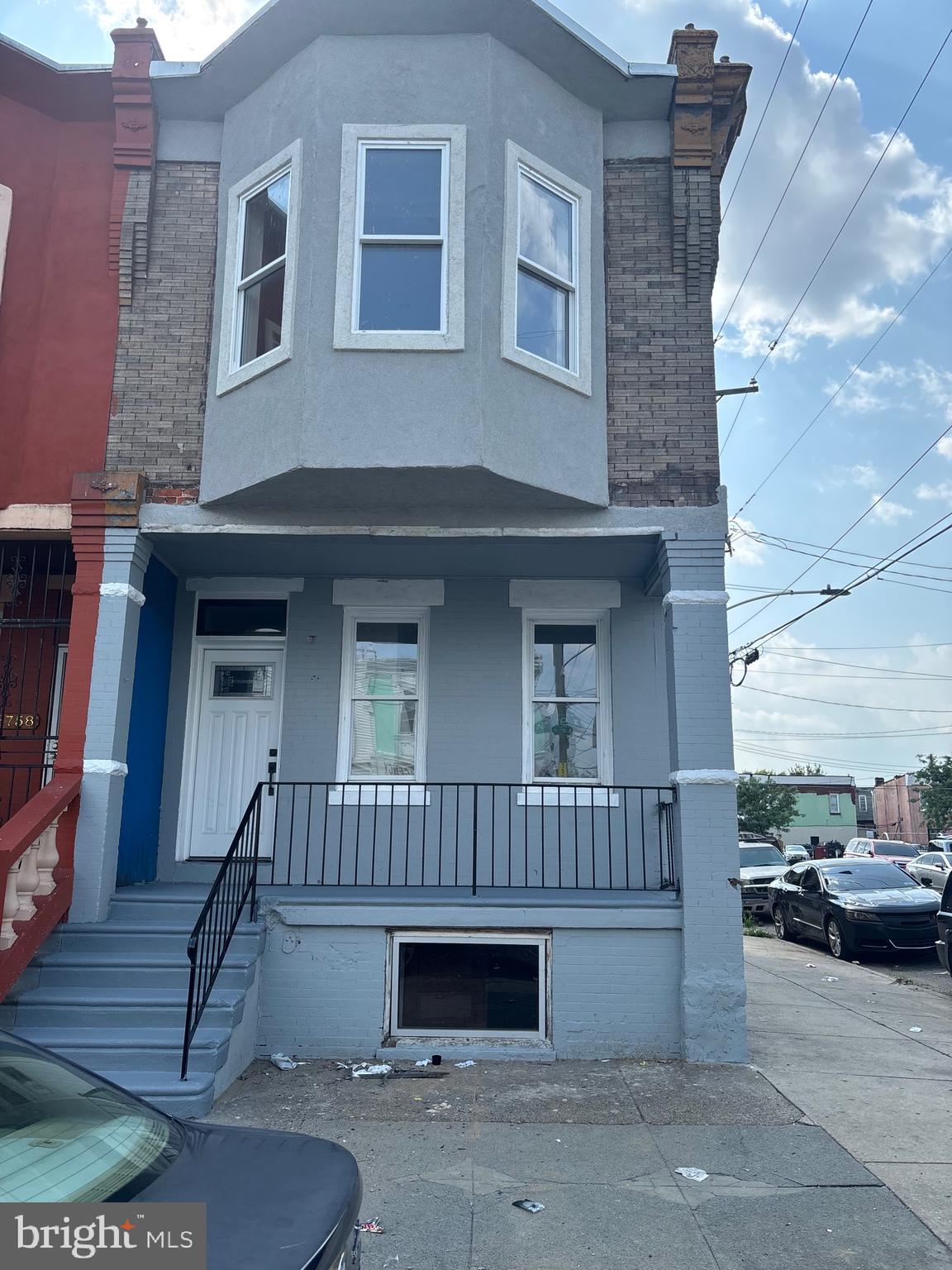 3760 North 9th Street Philadelphia, PA 19140 - Photo 1 of 17 a front view of a house with a yard