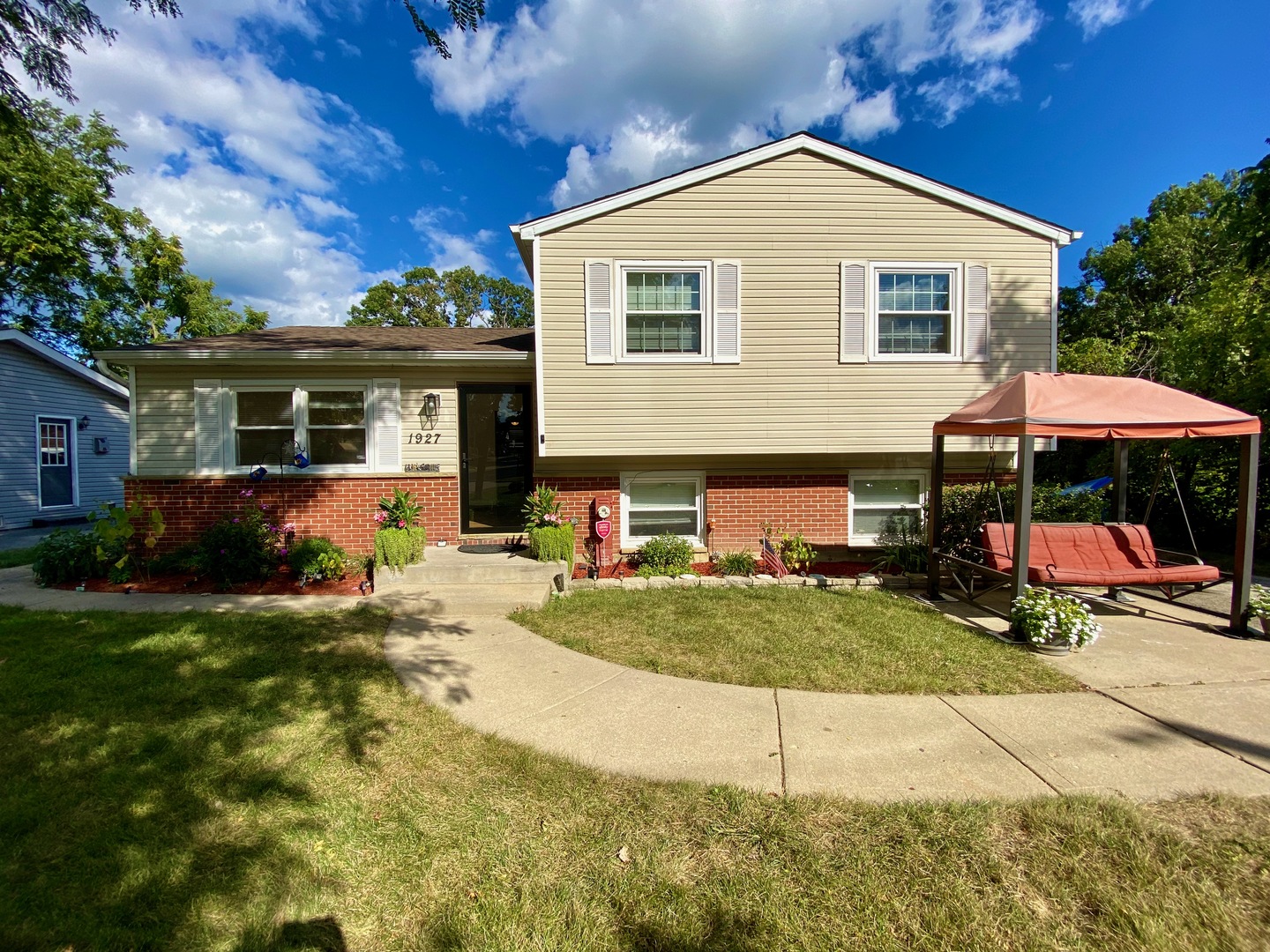 a view of house with outdoor space and view of house