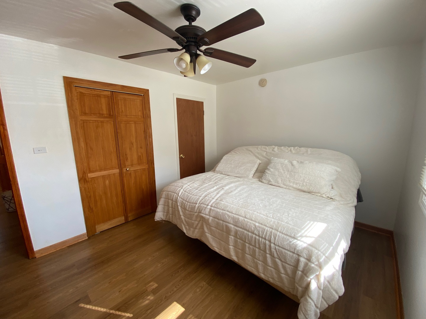 1927 Dugdale Road North Chicago, IL 60064 - Photo 14 of 36 a bed sitting in a room next to a window