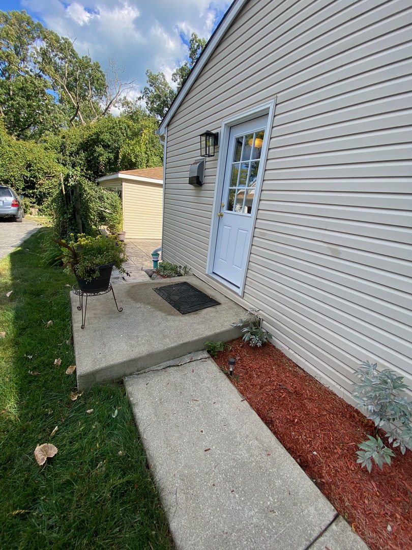 1927 Dugdale Road North Chicago, IL 60064 - Photo 30 of 36 a view of a backyard with sitting area