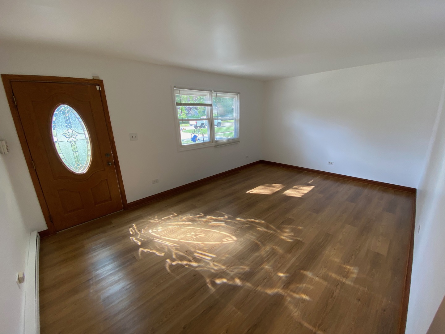 1927 Dugdale Road North Chicago, IL 60064 - Photo 4 of 36 an empty room with wooden floor and windows