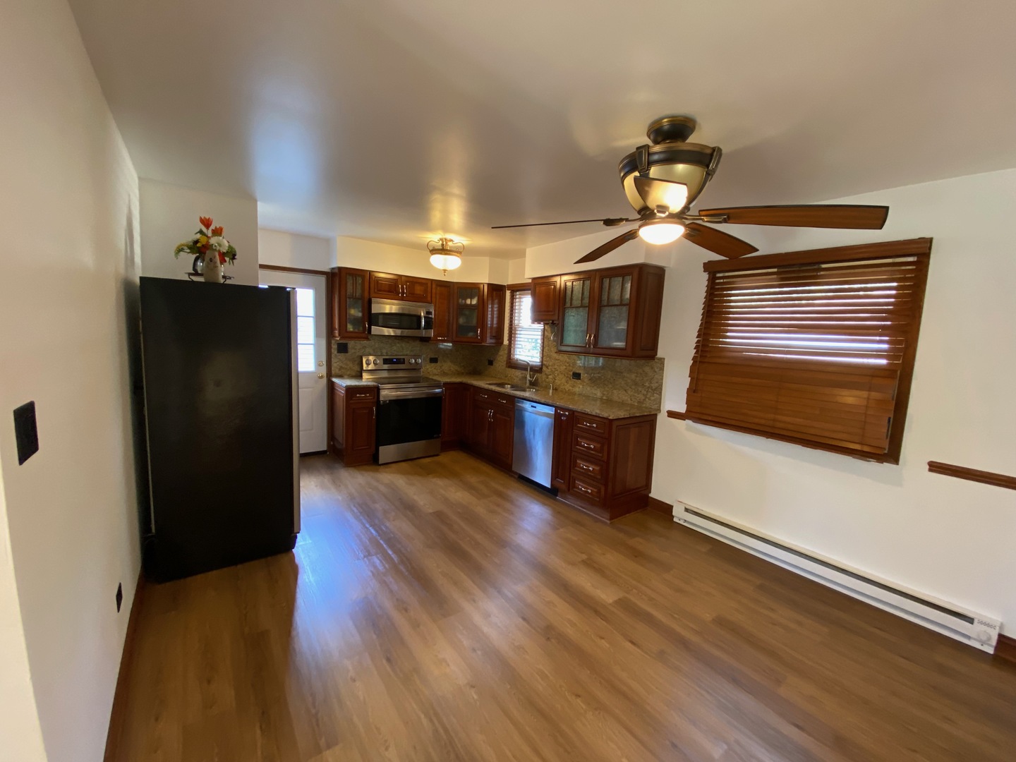 1927 Dugdale Road North Chicago, IL 60064 - Photo 7 of 36 a kitchen with stainless steel appliances granite countertop a refrigerator and a stove