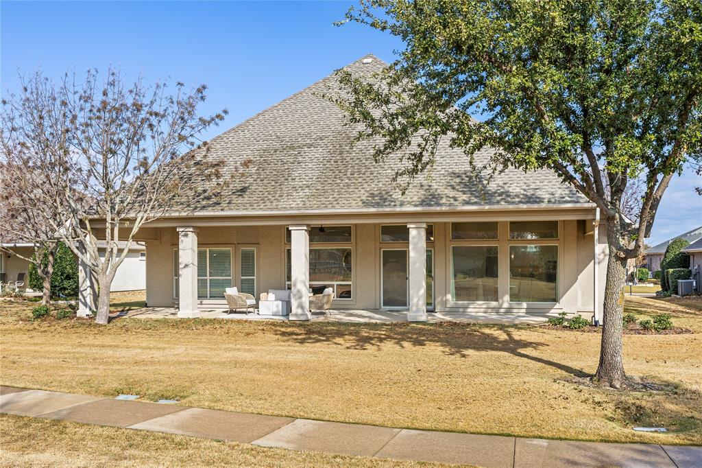 10409 Countryside Drive Denton, TX 76207 - Photo 34 of 38 View of front facade with stucco siding, roof with shingles, and a patio