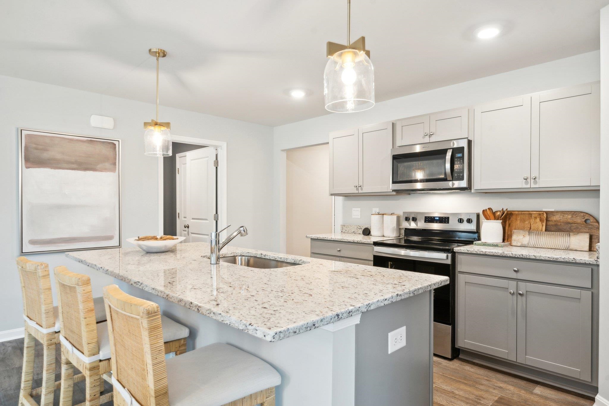 289 Heather Lane Staunton, VA 24401 - Photo 9 of 19 a kitchen with granite countertop kitchen island cabinets and a sink