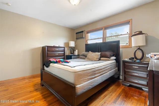 a bedroom with a bed and a table