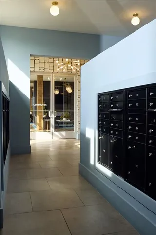 a lobby with furniture and a ceiling fan