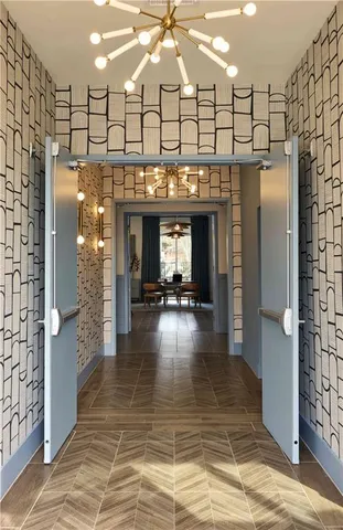 a lobby with furniture and a fireplace