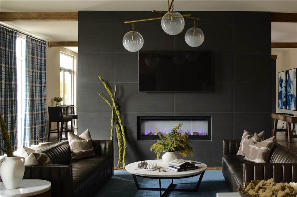 1809 Appaloosa Lane Northeast, Unit 3C Buford, GA 30519 - Photo 10 of 15 a living room with furniture and a fireplace