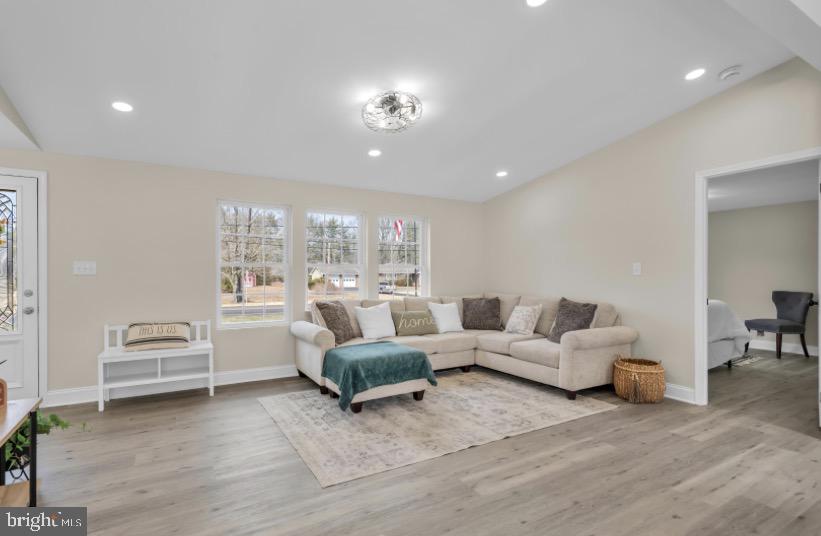 1230 Winslow Road Williamstown, NJ 08094 - Photo 16 of 34 a living room with furniture and a chandelier