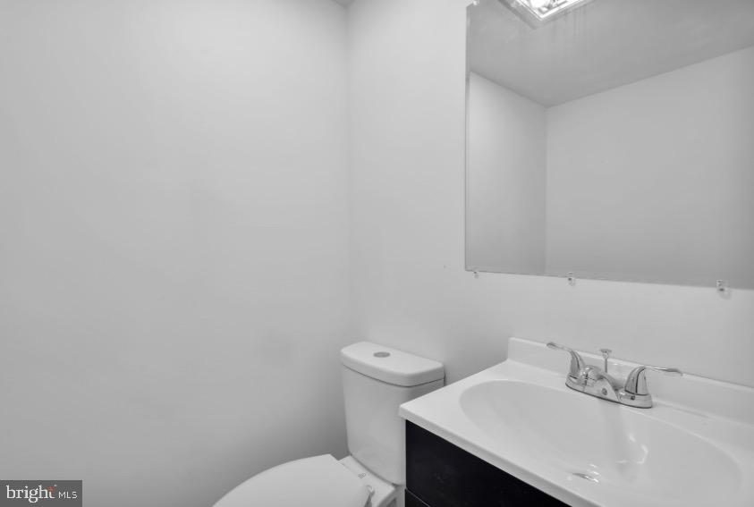 1230 Winslow Road Williamstown, NJ 08094 - Photo 34 of 34 a bathroom with a sink a toilet and mirror