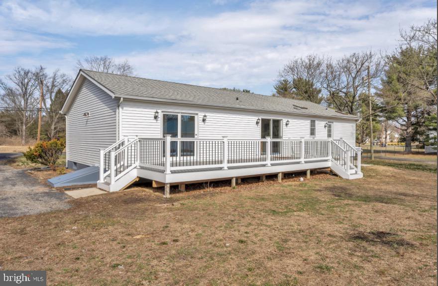 1230 Winslow Road Williamstown, NJ 08094 - Photo 7 of 34 a white house that has a small yard and a wooden fence